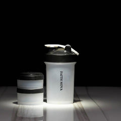 SHAKER BOTTLE WITH STORAGE COMPARTMENTS