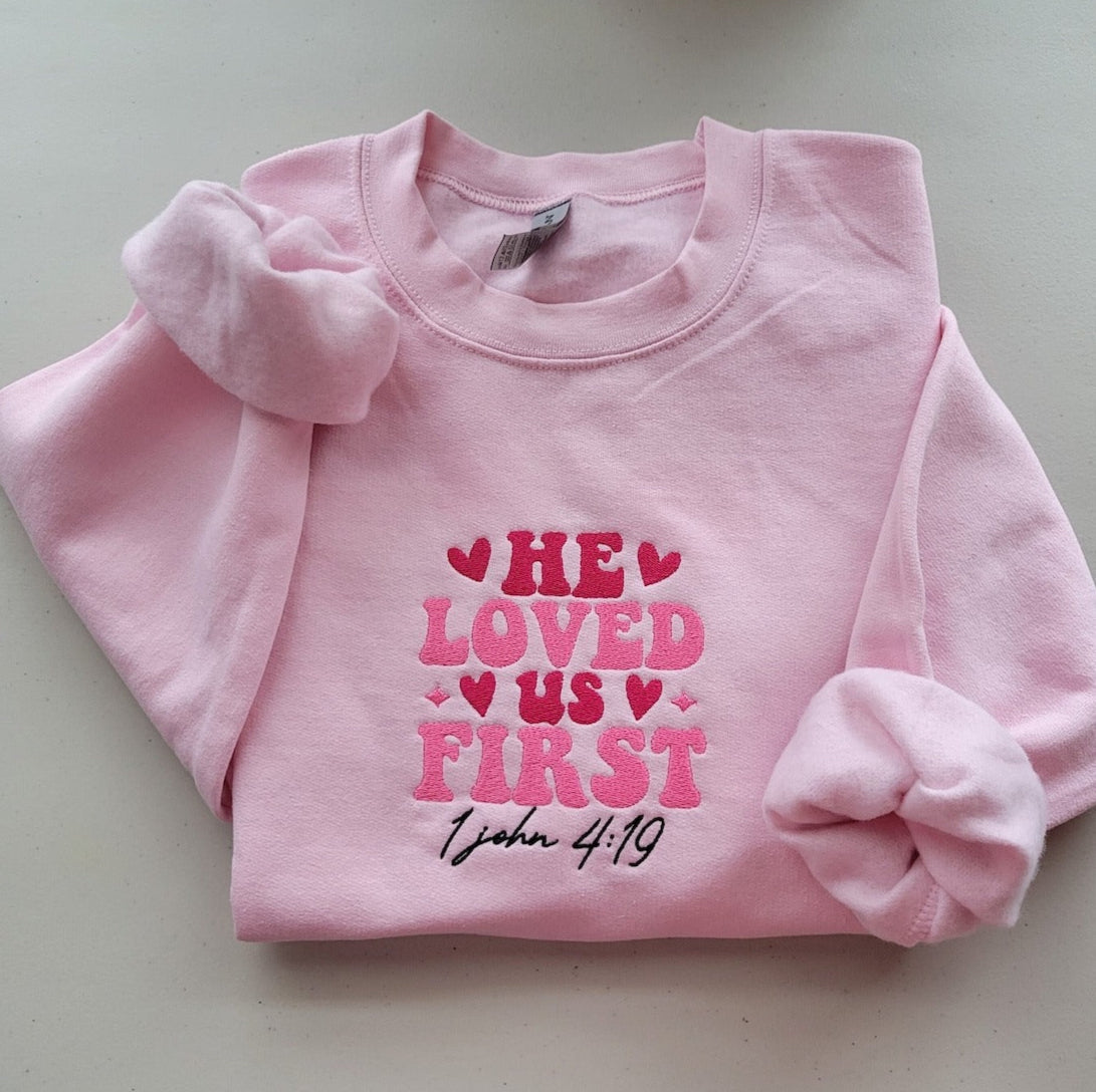 Embroidered He Loved Us First Sweatshirt