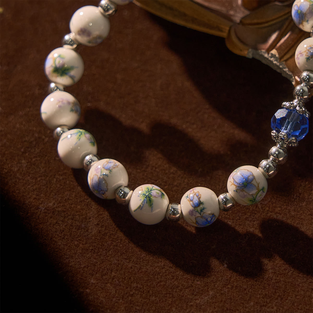 Multi-color Floral Ceramic Stretch Bracelet with Miraculous Medal & Crucifix: Subtle Faith Elegance