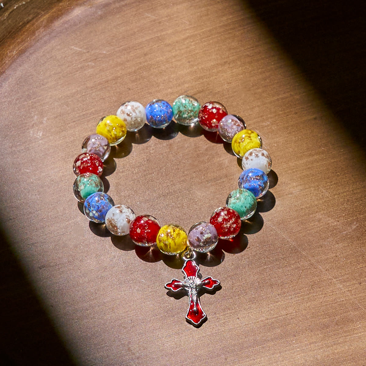 Colorful Glow-in-the-Dark Gold-Flecked Glass Bracelets with Crucifix