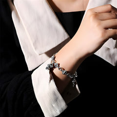Retro - Styled Sterling Silver Cross Bracelet with Floral Motifs: A Nostalgic Sign of Faith